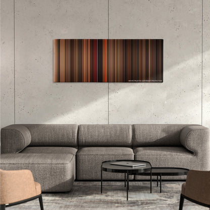 Gone with the Wind color palette canvas on a concrete wall above a gray sectional sofa
