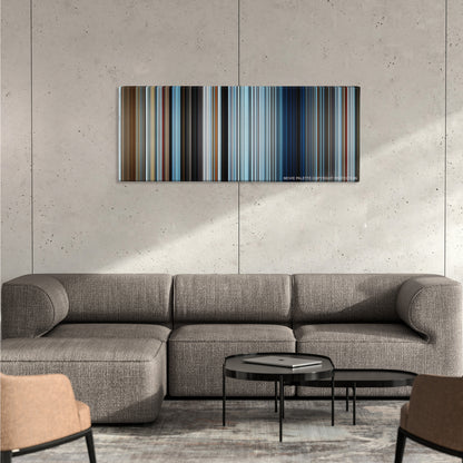 Everest color palette canvas on a concrete wall above a gray sectional sofa