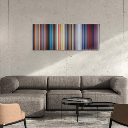Mulan color palette canvas on a concrete wall above a gray sectional sofa