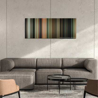 Away We Go color palette canvas on a concrete wall above a gray sectional sofa