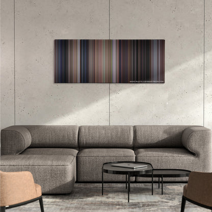 Scream color palette canvas on a concrete wall above a gray sectional sofa