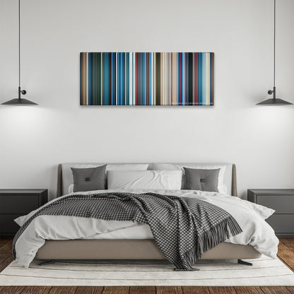 Aquaman color palette canvas above a bed, between two black pendant lamps