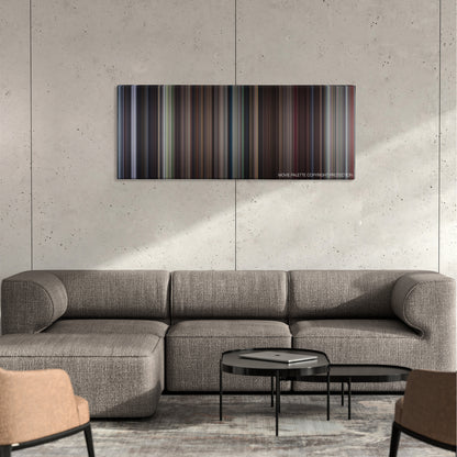Elizabethtown color palette canvas on a concrete wall above a gray sectional sofa