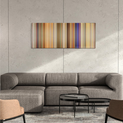 White Chicks color palette canvas on a concrete wall above a gray sectional sofa