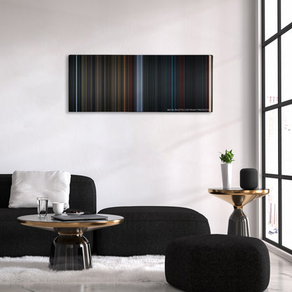 Life color palette canvas above a black sofa with a gold-topped table