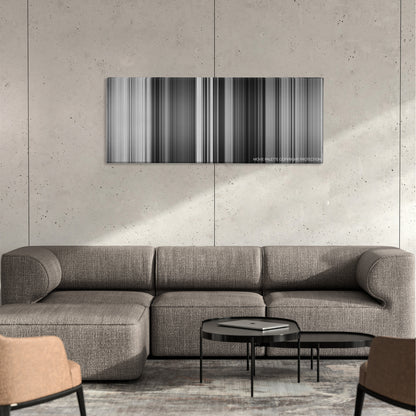 Psycho color palette canvas on a concrete wall above a gray sectional sofa