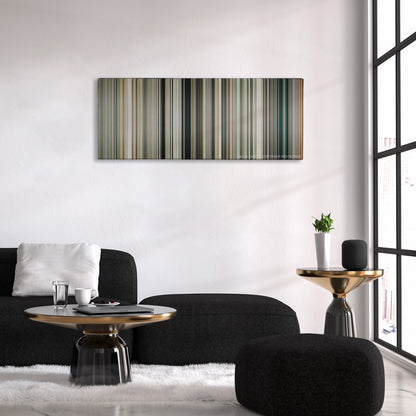 Jason Bourne color palette canvas above a black sofa with a gold-topped table
