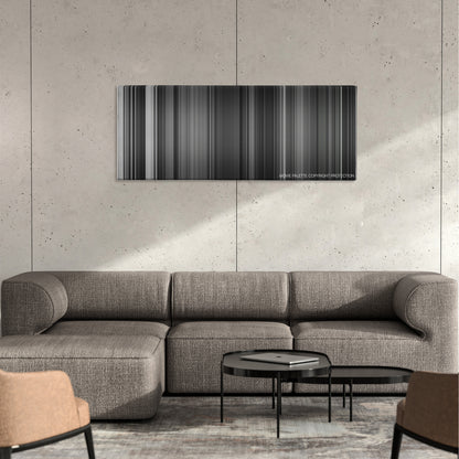 Dr. Strangelove color palette canvas on a concrete wall above a gray sectional sofa