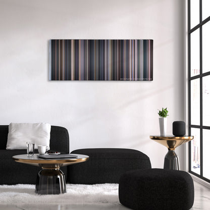 Cinema Paradiso color palette canvas above a black sofa with a gold-topped table