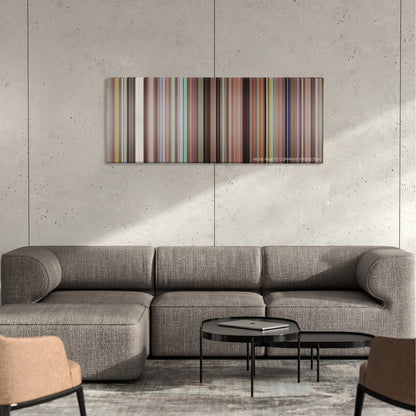 Borat color palette canvas on a concrete wall above a gray sectional sofa
