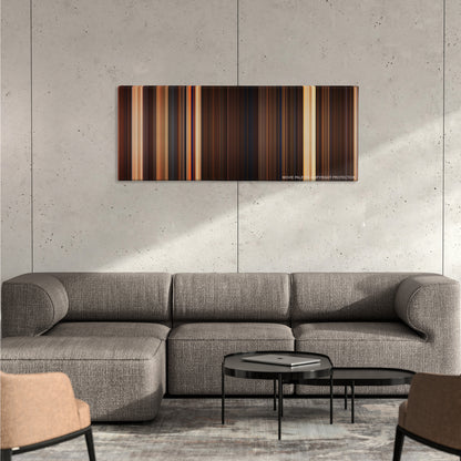 The Mummy color palette canvas on a concrete wall above a gray sectional sofa