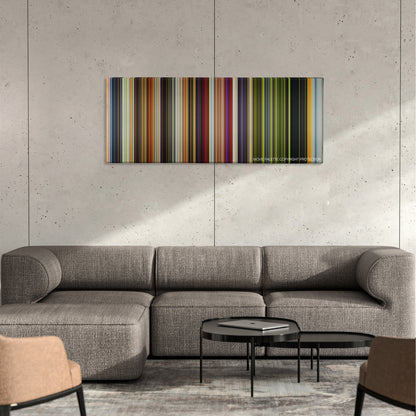 Raging Bull color palette canvas on a concrete wall above a gray sectional sofa