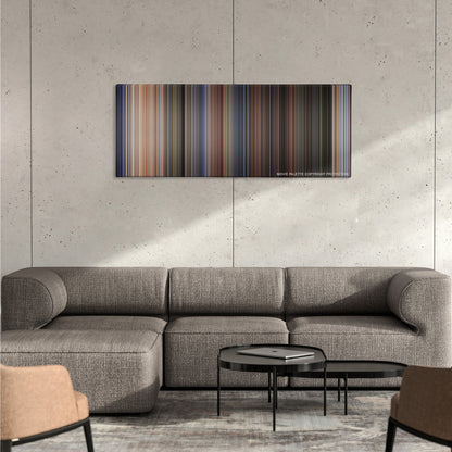 Twister color palette canvas on a concrete wall above a gray sectional sofa