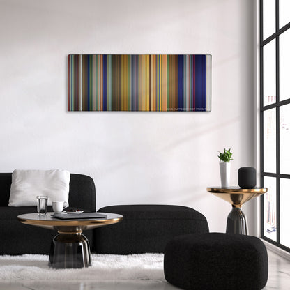 Tarzan color palette canvas above a black sofa with a gold-topped table