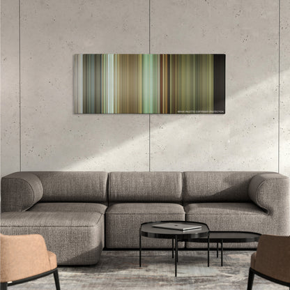 Before Midnight color palette canvas on a concrete wall above a gray sectional sofa
