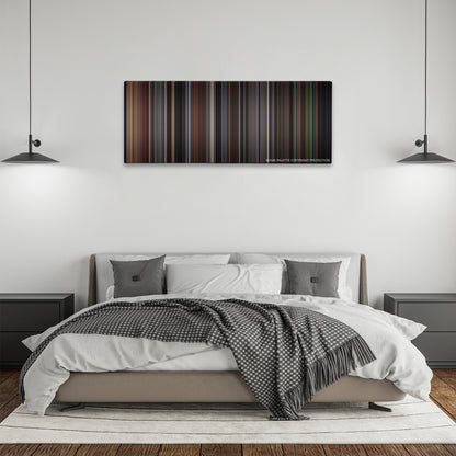 Vertigo color palette canvas above a bed, between two black pendant lamps