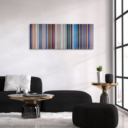 Monsters, Inc. color palette canvas above a black sofa with a gold-topped table