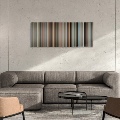 The Other Guys color palette canvas on a concrete wall above a gray sectional sofa