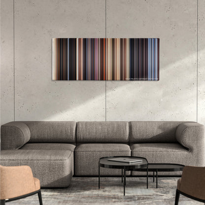 Close Encounters of the Third Kind color palette canvas on a concrete wall above a gray sectional sofa