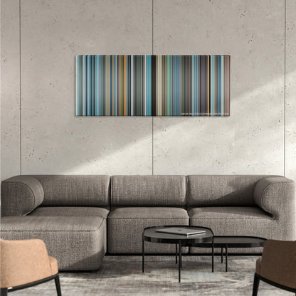 The Secret Life of Walter Mitty color palette canvas on a concrete wall above a gray sectional sofa