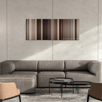 The Mummy Returns color palette canvas on a concrete wall above a gray sectional sofa