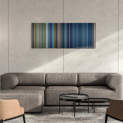 Armageddon color palette canvas on a concrete wall above a gray sectional sofa