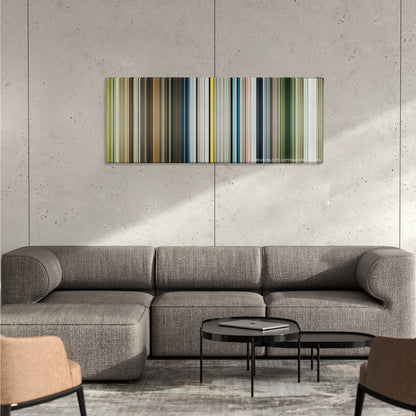 Life of Pi color palette canvas on a concrete wall above a gray sectional sofa