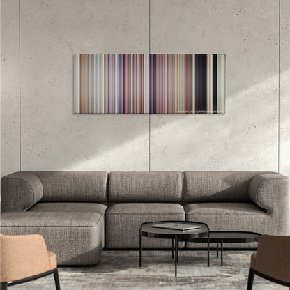 Napoleon Dynamite color palette canvas on a concrete wall above a gray sectional sofa