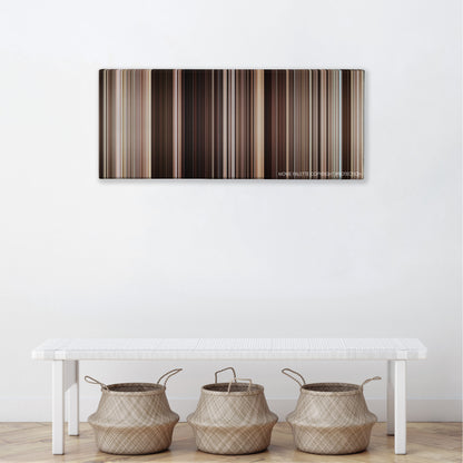 The Mummy Returns color palette canvas above a white bench with three woven baskets