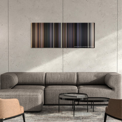 The Lone Ranger color palette canvas on a concrete wall above a gray sectional sofa