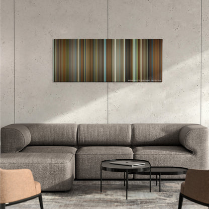 The Princess Diaries color palette canvas on a concrete wall above a gray sectional sofa