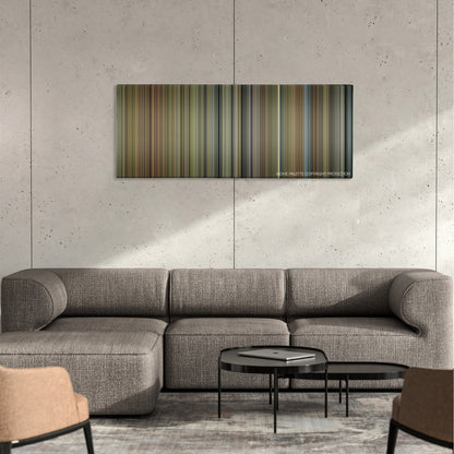 The Elephant Man color palette canvas on a concrete wall above a gray sectional sofa