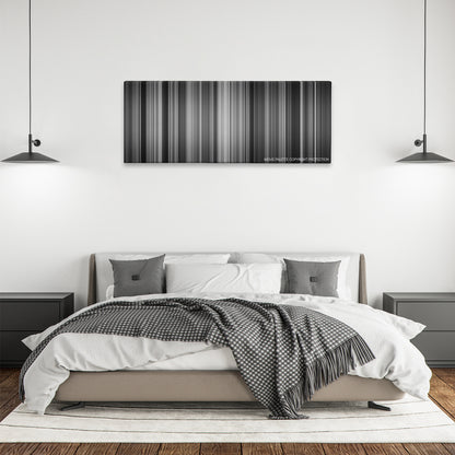 Role Models color palette canvas above a bed, between two black pendant lamps