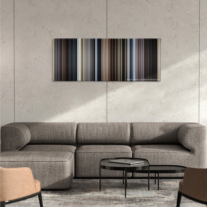Cast Away color palette canvas on a concrete wall above a gray sectional sofa