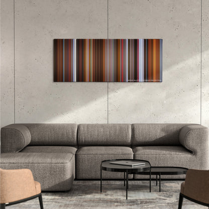 Rounders color palette canvas on a concrete wall above a gray sectional sofa