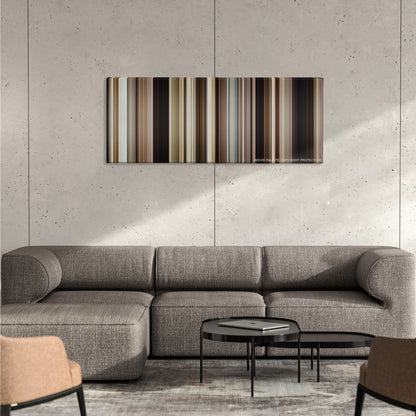 Mud color palette canvas on a concrete wall above a gray sectional sofa
