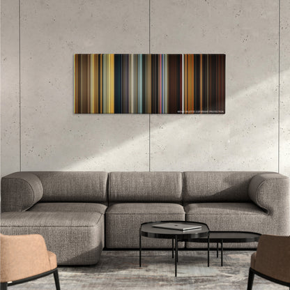 Apocalypse Now color palette canvas on a concrete wall above a gray sectional sofa