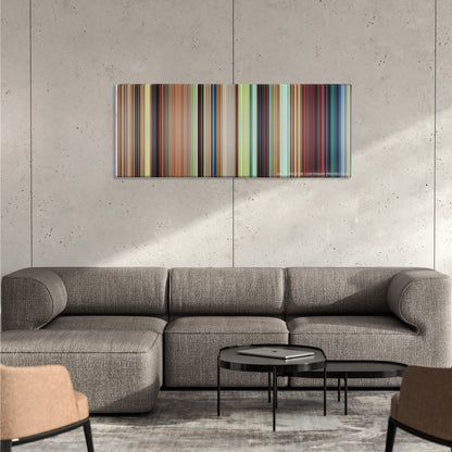 Howl's Moving Castle color palette canvas on a concrete wall above a gray sectional sofa