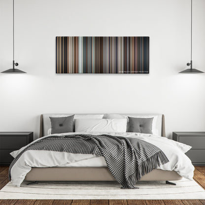 Lion color palette canvas above a bed, between two black pendant lamps