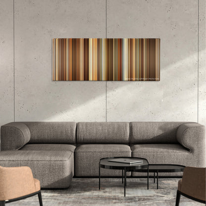 The Girl with the Dragon Tattoo color palette canvas on a concrete wall above a gray sectional sofa