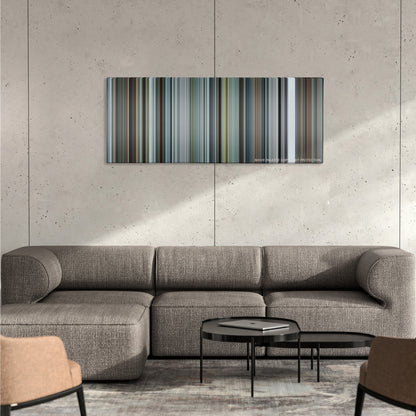 Burnt color palette canvas on a concrete wall above a gray sectional sofa