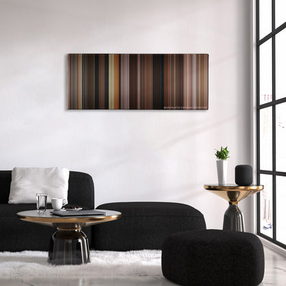 Dogma color palette canvas above a black sofa with a gold-topped table