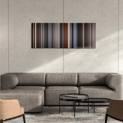 The Usual Suspects color palette canvas on a concrete wall above a gray sectional sofa