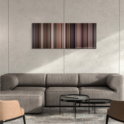 Tootsie color palette canvas on a concrete wall above a gray sectional sofa