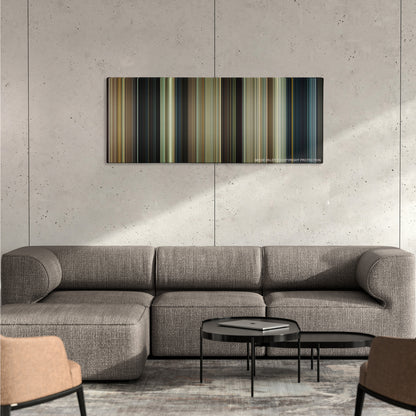Paul color palette canvas on a concrete wall above a gray sectional sofa