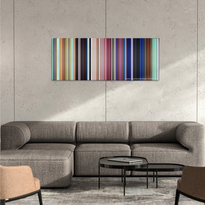 Moana color palette canvas on a concrete wall above a gray sectional sofa