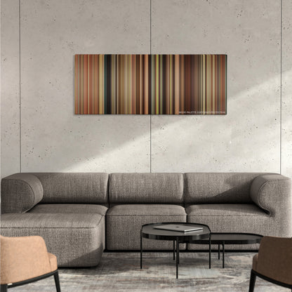 The Help color palette canvas on a concrete wall above a gray sectional sofa