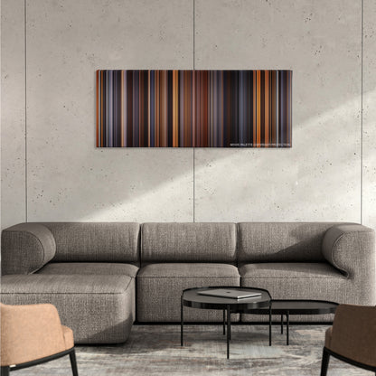 The English Patient color palette canvas on a concrete wall above a gray sectional sofa