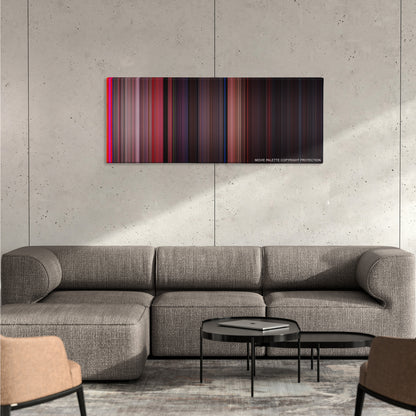 West Side Story color palette canvas on a concrete wall above a gray sectional sofa