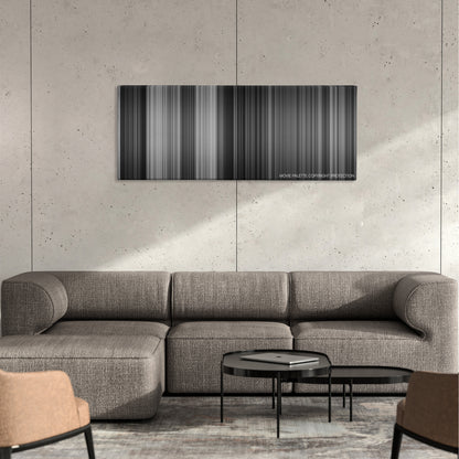 The Third Man color palette canvas on a concrete wall above a gray sectional sofa